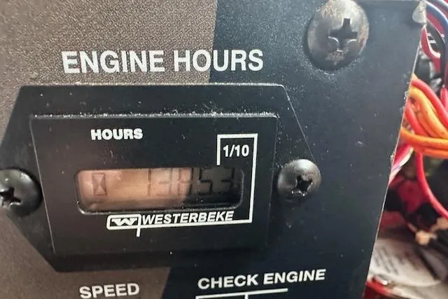 Slide: The Image of Engine hour meter displaying 1353 hours on a 2019 Regal 33 OBX boat. - 28