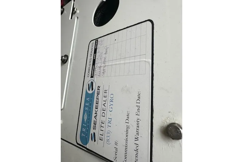 Slide: The Image of Seakeeper Elite Dealer label on 2019 Regal 33 OBX boat panel. - 29