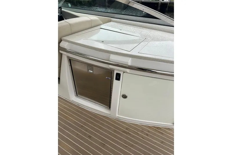 Slide: The Image of 2019 Regal 33 OBX boat interior with sleek countertop and built-in storage. - 36