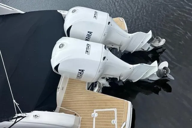 Slide: The Image of 2019 Regal 33 OBX boat with twin Yamaha 350 engines on water. - 40