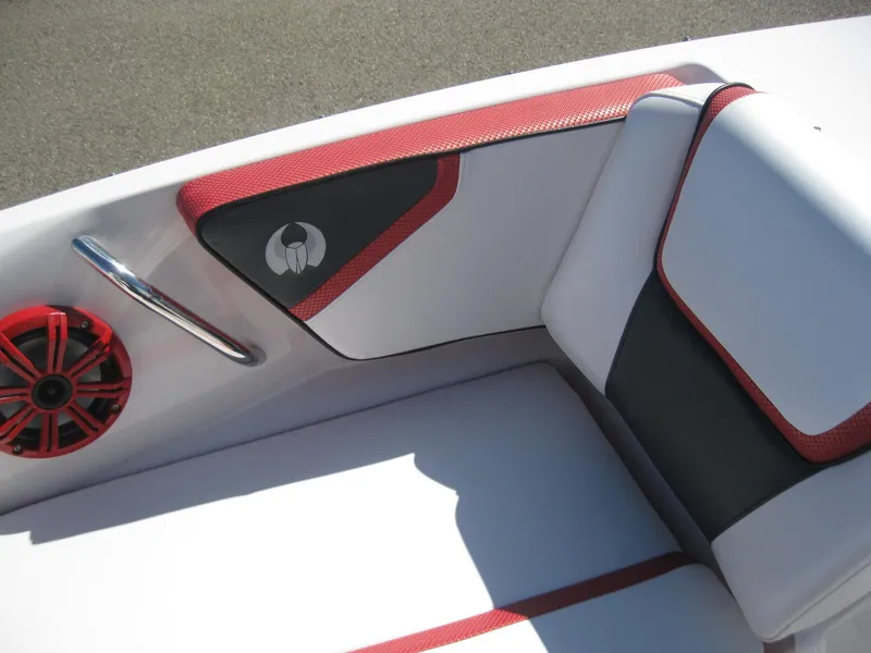 Slide: The Image of Interior seating of a 2016 Scarab 195 HO Impulse boat with red and black accents. - 4