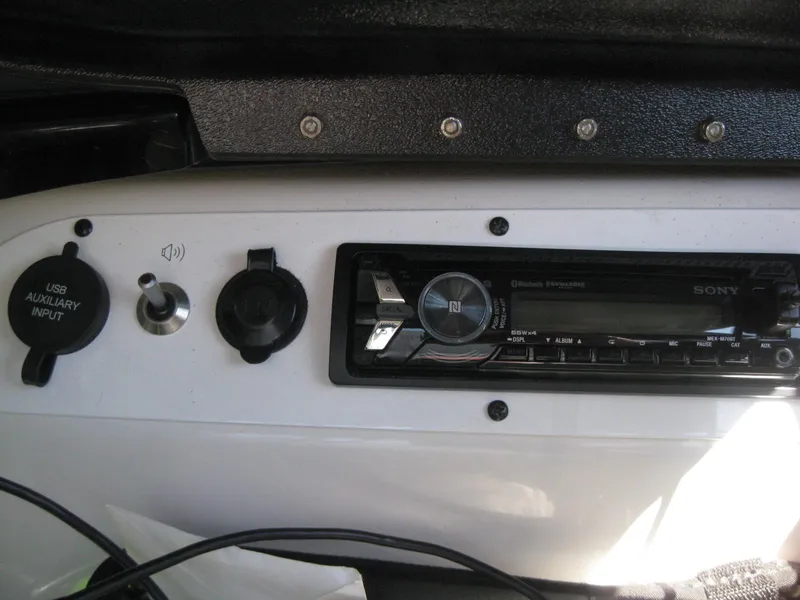 Slide: The Image of 2016 Scarab 195 HO Impulse boat dashboard with Sony stereo and USB auxiliary input. - 7