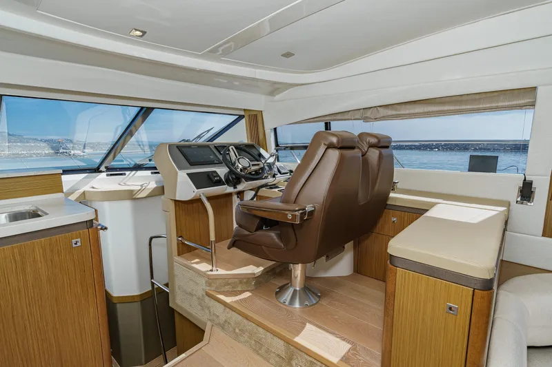 Slide: The Image of Interior of 2018 Sea Ray Fly 510 yacht with modern helm and seating. - 26