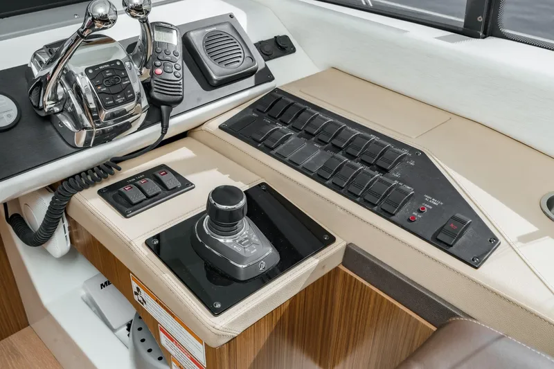 Slide: The Image of Control panel of 2018 Sea Ray Fly 510 yacht with joystick and switches. - 30