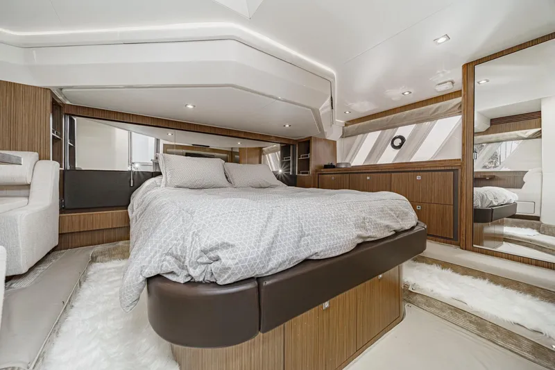 Slide: The Image of Luxurious bedroom interior of 2018 Sea Ray Fly 510 yacht with modern design and cozy bedding. - 35