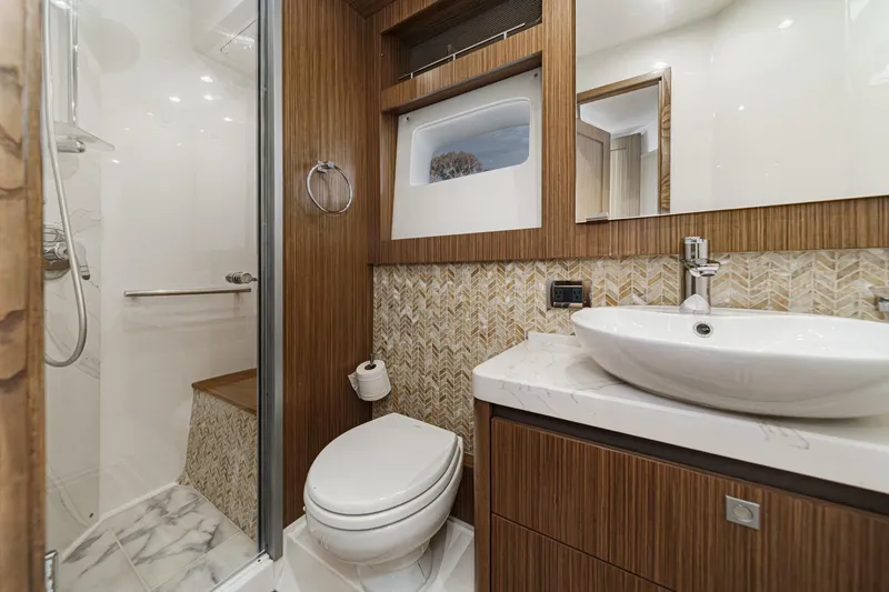 Slide: The Image of Luxurious bathroom in 2018 Sea Ray Fly 510 yacht with modern fixtures and elegant design. - 40