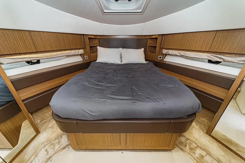 Slide: The Image of Luxurious bedroom interior of 2018 Sea Ray Fly 510 yacht with cozy bedding. - 41