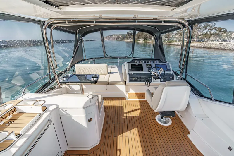 Slide: The Image of Luxurious 2018 Sea Ray Fly 510 yacht interior with helm, seating, and ocean view. - 47