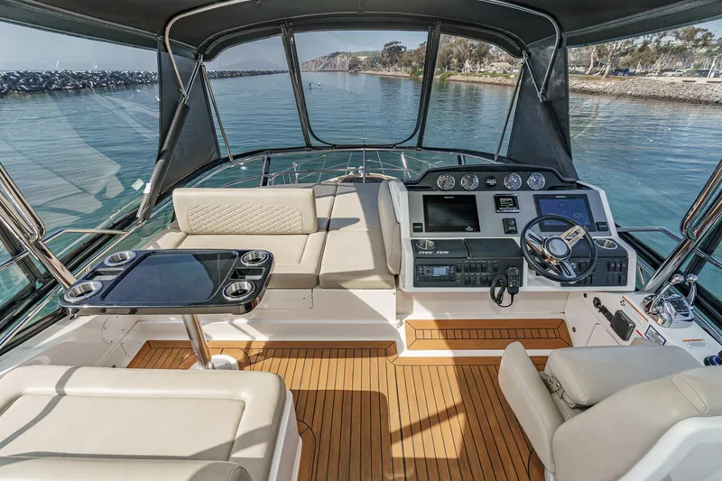 Slide: The Image of Luxurious 2018 Sea Ray Fly 510 yacht cockpit with modern controls and seating. - 48