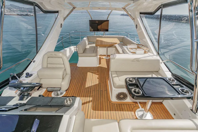 Slide: The Image of Luxurious 2018 Sea Ray Fly 510 yacht interior with elegant seating and ocean view. - 53