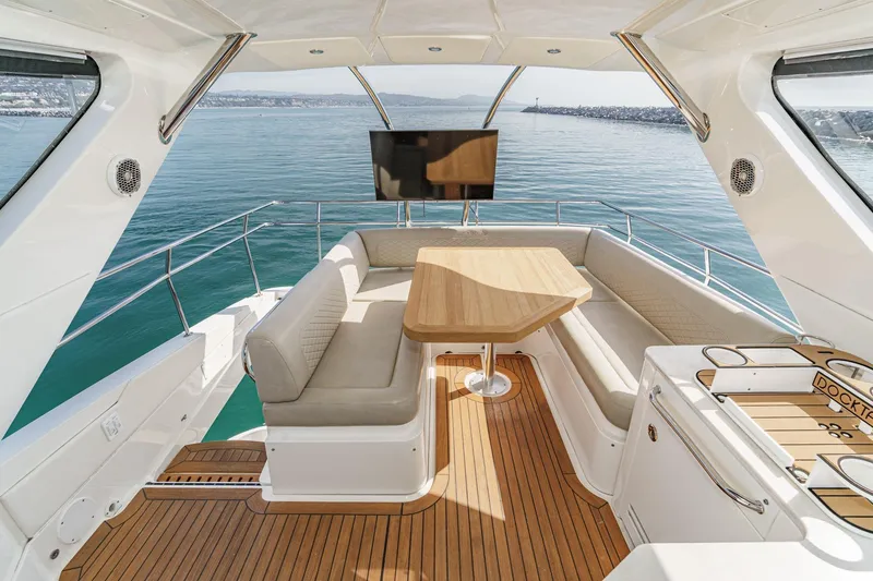 Slide: The Image of Luxurious 2018 Sea Ray Fly 510 yacht interior with elegant seating and ocean view. - 54