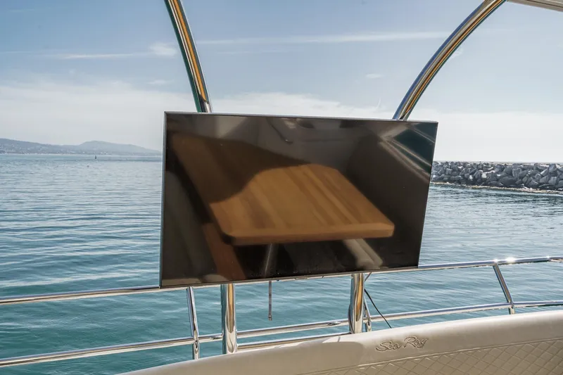 Slide: The Image of 2018 Sea Ray Fly 510 yacht with TV, ocean view, and sleek design. - 58
