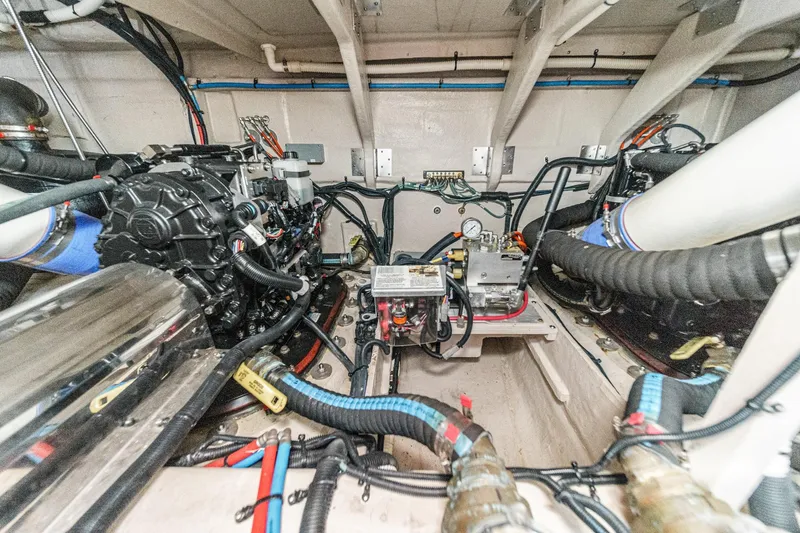 Slide: The Image of Engine room of 2018 Sea Ray Fly 510 yacht, showcasing mechanical components and wiring. - 61