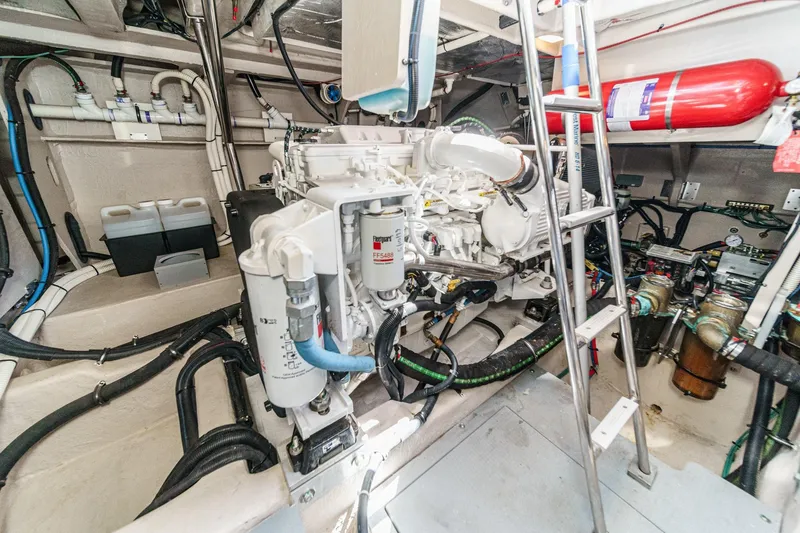 Slide: The Image of Engine room of 2018 Sea Ray Fly 510 yacht with visible machinery and equipment. - 63