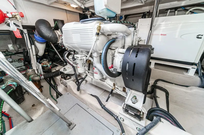 Slide: The Image of Engine room of 2018 Sea Ray Fly 510 yacht, featuring Cummins Onan generator. - 64