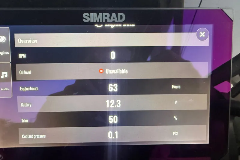 Slide: The Image of Simrad display showing 2025 Sea Ray SDX 270 Outboard engine data: RPM, oil level, battery, and more. - 18