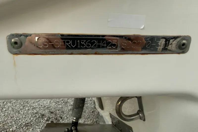 Slide: The Image of 2025 Sea Ray SDX 270 Outboard identification plate with engraved serial number. - 19