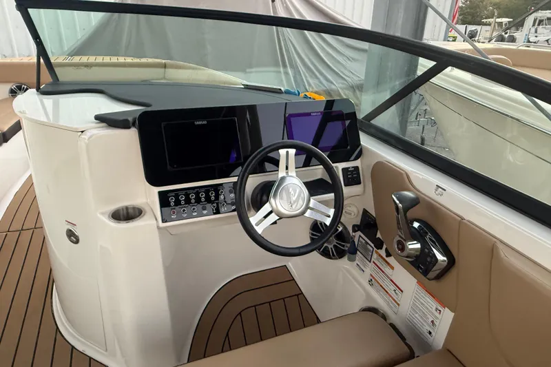 Slide: The Image of 2025 Sea Ray SDX 270 Outboard helm with modern controls and sleek design. - 8