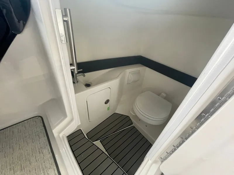 Slide: The Image of Interior of 2026 Sea Ray SLX 280 Outboard with toilet. - 16