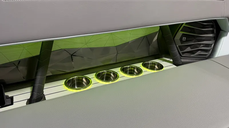 Slide: The Image of Interior of the Nautique Super Air Nautique G25 with illuminated cup holders and modern design. - 29