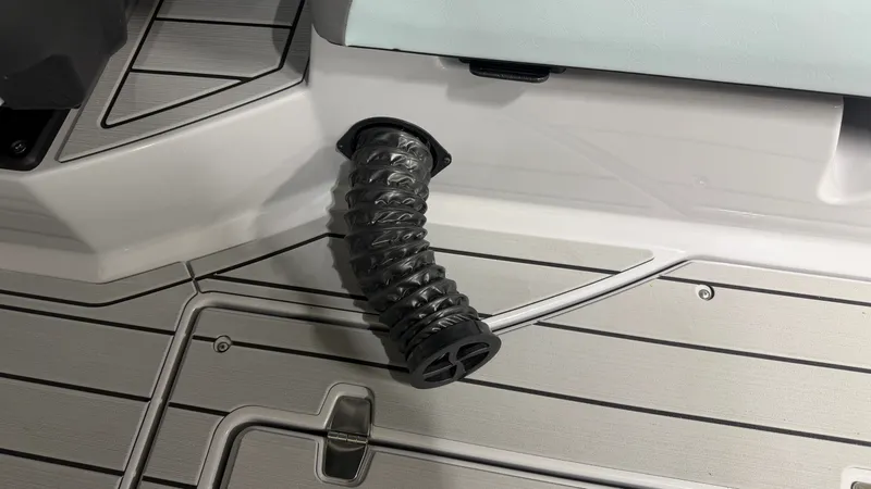 Slide: The Image of Close-up of a flexible vent hose on the deck of a Nautique boat. - 25