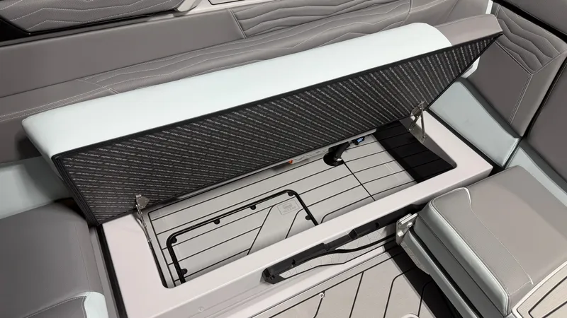 Slide: The Image of The boat's open bench seat reveals storage space underneath. - 31