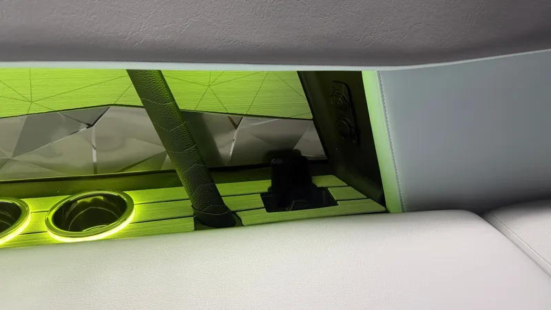 Slide: The Image of Interior of the Nautique Super Air Nautique G25 with illuminated cup holders and modern design. - 41