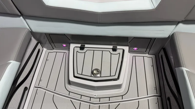 Slide: The Image of The image shows the interior of a 2026 Nautique Super Air Nautique G25 with sleek seating and LED lighting. - 35