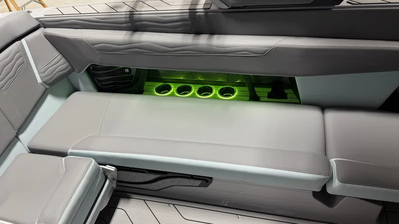 Slide: The Image of The image shows a modern gray boat seat with green LED lighting and cup holders. - 40