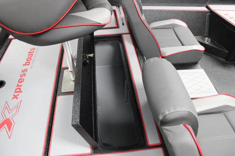 Slide: The Image of 2026 Xpress H18 boat interior with gray and red seating and storage compartment. - 9