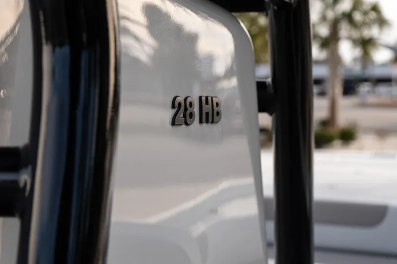 Slide: The Image of Close-up of 2026 Caymas 28 HB boat model emblem. - 17