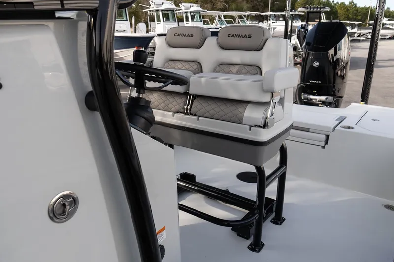 Slide: The Image of 2026 Caymas 28 HB boat interior with dual seats and steering console. - 19