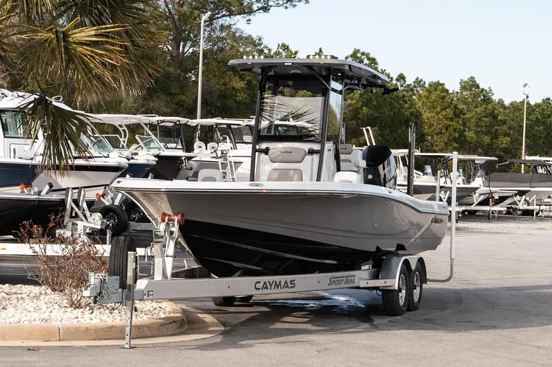 Slide: The Image of 2026 Caymas 28 HB boat on trailer in marina setting. - 3