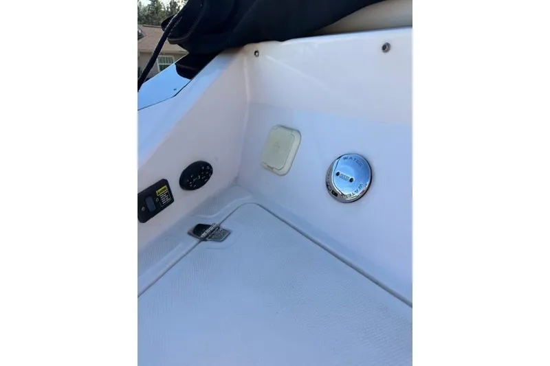 Slide: The Image of 2005 Regal 2200 Bowrider interior detail with control panel and fittings. - 12