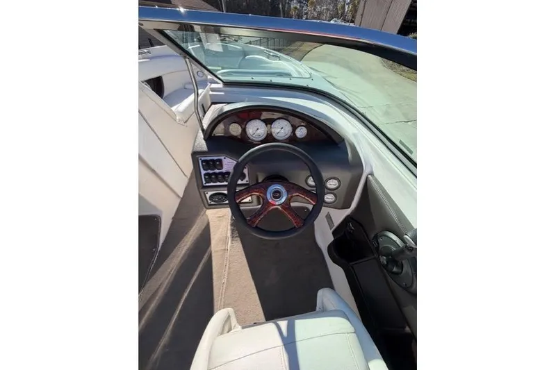 Slide: The Image of 2005 Regal 2200 Bowrider dashboard with steering wheel and instrument panel. - 5