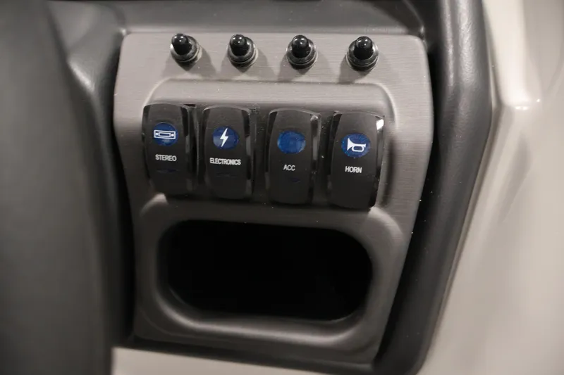 Slide: The Image of Control panel of 2026 Bentley Pontoons 223 Navigator Tri-toon with labeled switches. - 23