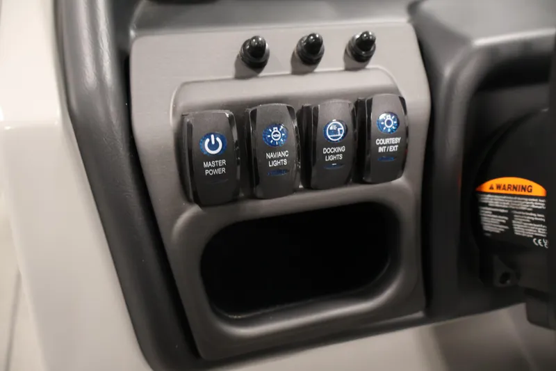 Slide: The Image of Control panel of 2026 Bentley Pontoons 223 Navigator Tri-toon with labeled switches. - 22