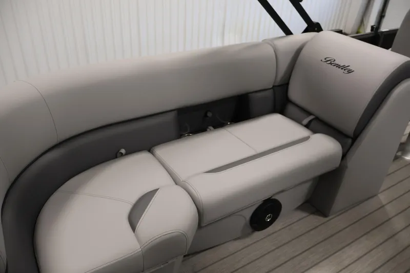 Slide: The Image of 2026 Bentley Pontoons 223 Navigator Tri-toon interior seating, featuring luxurious gray upholstery. - 32