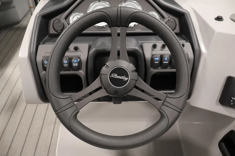 Slide: The Image of Steering wheel of 2026 Bentley Pontoons 223 Navigator Tri-toon, showcasing dashboard controls. - 20
