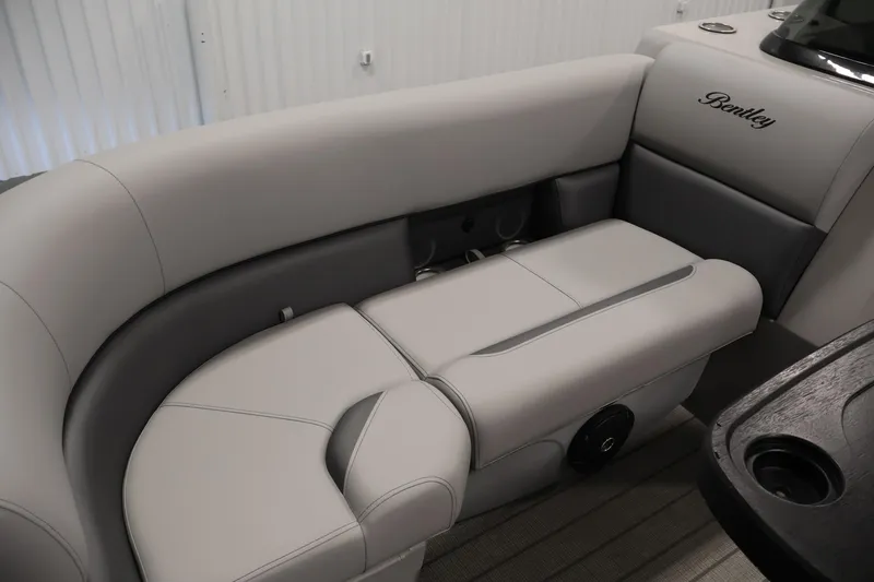 Slide: The Image of 2026 Bentley Pontoons 223 Navigator Tri-toon interior seating, featuring luxurious gray upholstery. - 14