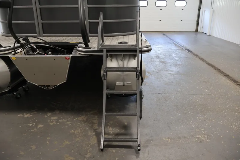 Slide: The Image of 2026 Bentley Pontoons 223 Navigator Tri-toon with ladder in a garage setting. - 39