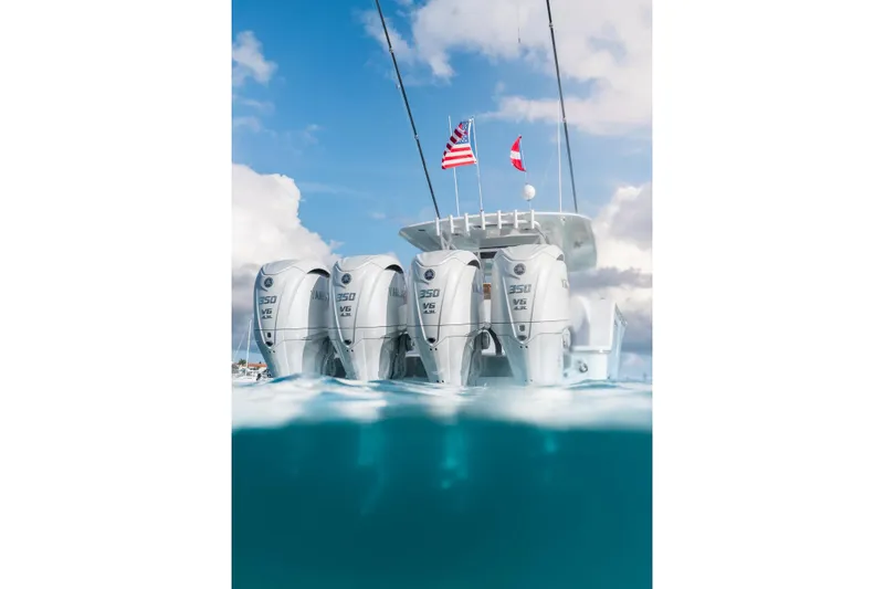 Slide: The Image of 2026 Sportsman Open 402 Center Console with quad Yamaha 350 engines, flags flying. - 4