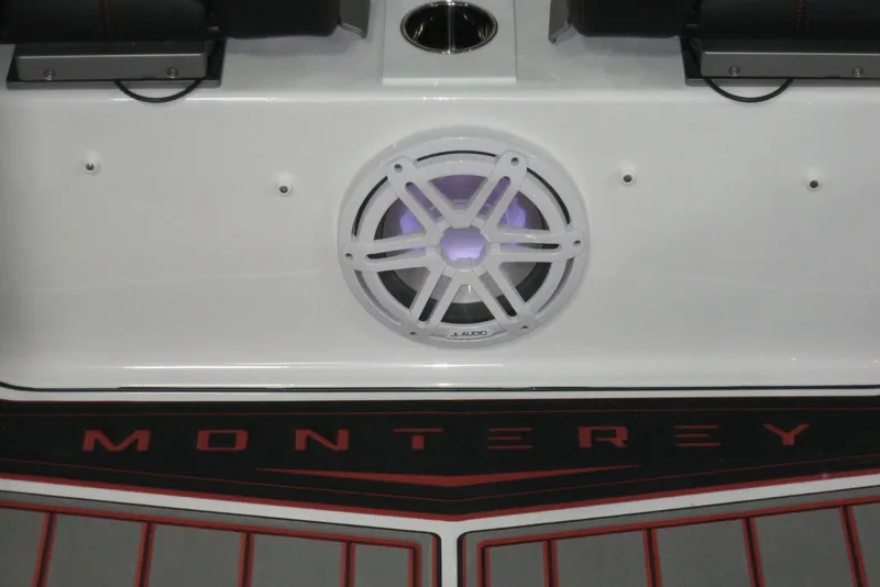 Slide: The Image of Interior view of 2025 Monterey Elite 27 OB boat with modern dashboard and seating. - 12