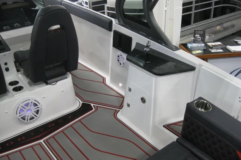 Slide: The Image of 2025 Monterey Elite 27 OB boat with JL Audio speaker and stylish deck design. - 13