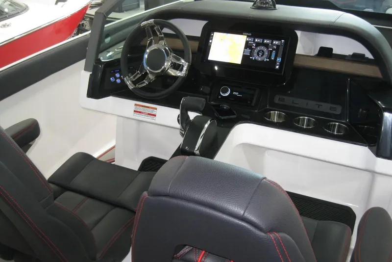 Slide: The Image of 2025 Monterey Elite 27 OB boat interior with seating, speaker, and sink. - 14