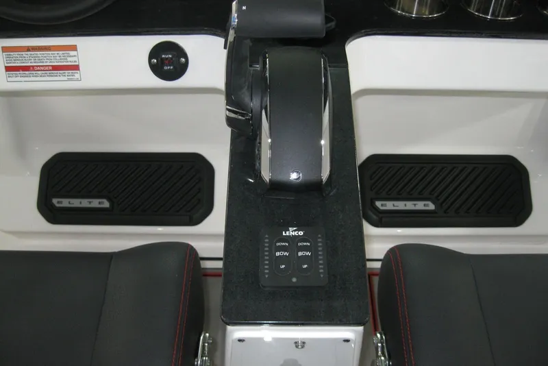 Slide: The Image of 2025 Monterey Elite 27 OB boat interior with luxurious black and red seating. - 17