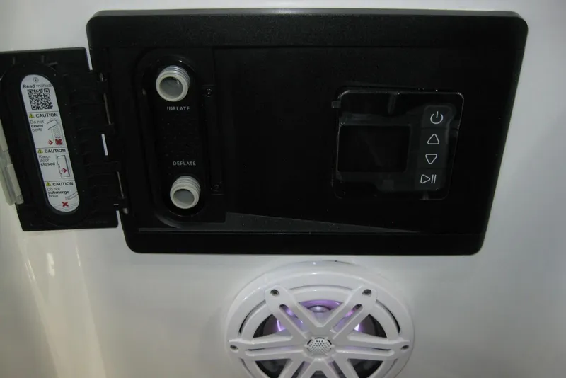 Slide: The Image of 2025 Monterey Elite 27 OB boat dashboard with controls and seating detail. - 18