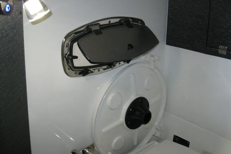 Slide: The Image of Interior of 2025 Monterey Elite 27 OB boat, featuring sleek cabinetry and modern design. - 22