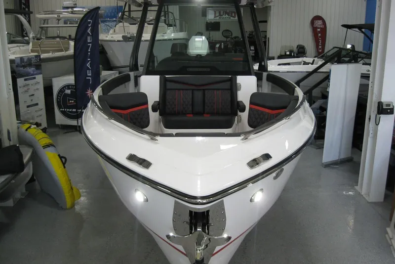 Slide: The Image of 2025 Monterey Elite 27 OB boat displayed in showroom on trailer. - 3