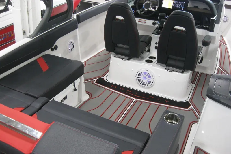 Slide: The Image of 2025 Monterey Elite 27 OB boat interior with modern seating and dashboard design. - 8